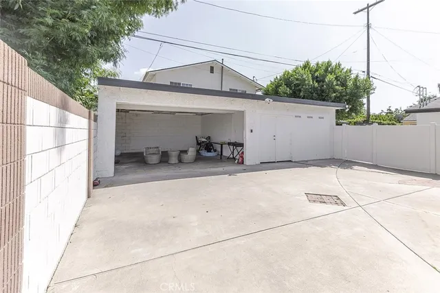 a view of a street with a garage