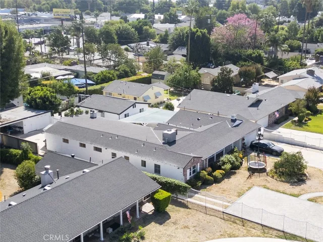 an aerial view of residential houses with outdoor space