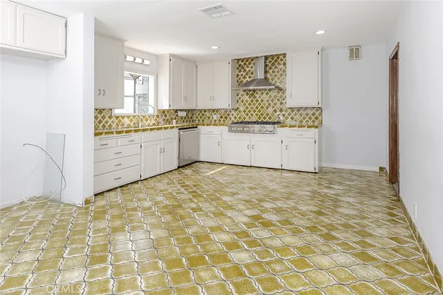 a large bathroom with a sink a mirror and a shower