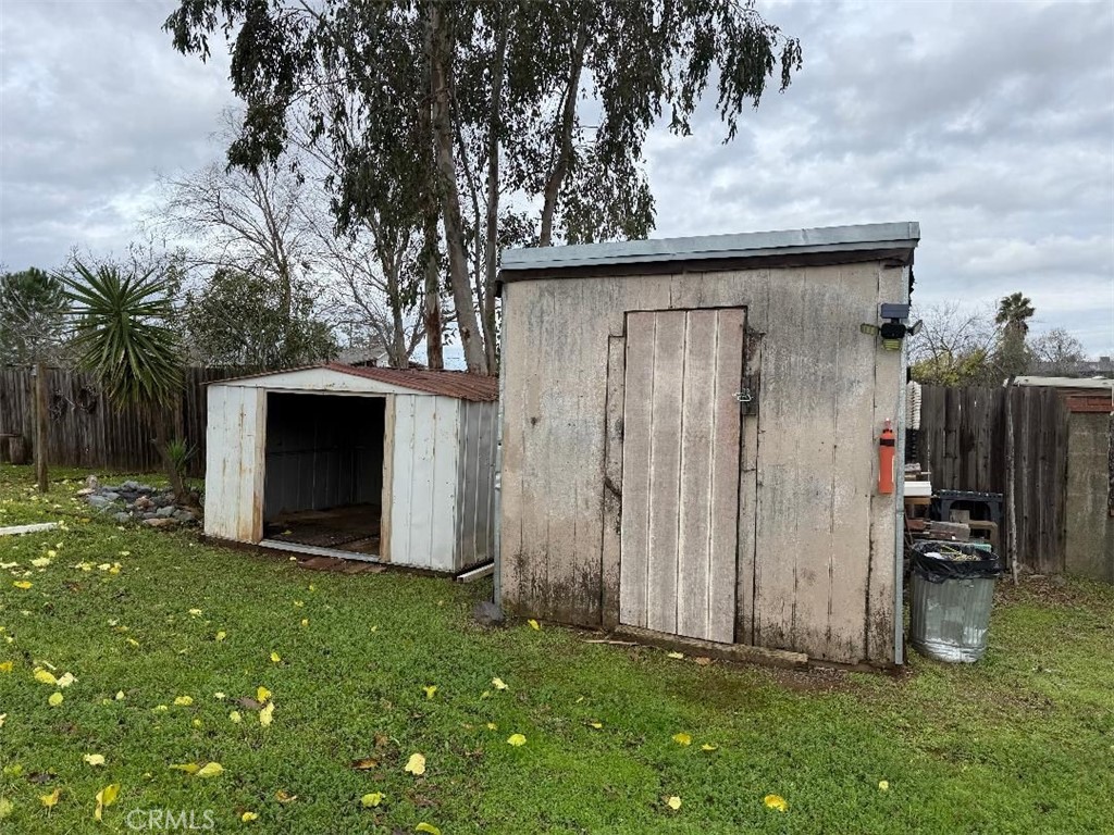23848 Hoag Road Corning, CA 96021 - Photo 8 of 8 a view of backyard with potted plants and a large tree