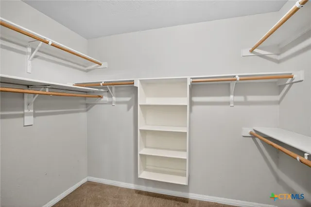 a view of an empty walk in closet