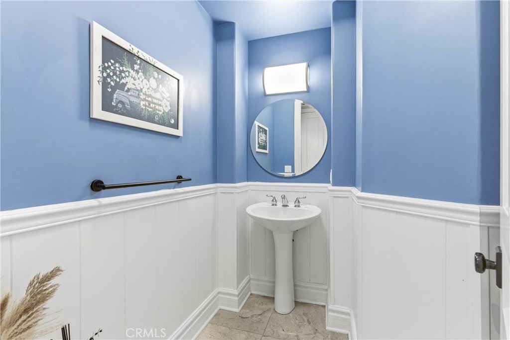 29131 Bouquet Canyon Road Silverado, CA 92676 - Photo 40 of 74 Powder room with pedestal sink and wainscoting