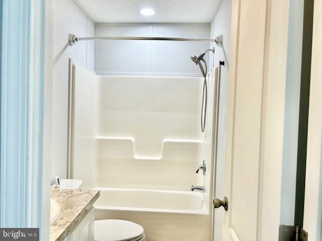 26 2nd Street Lothian, MD 20711 - Photo 18 of 27 a bathroom with a granite countertop shower and a toilet