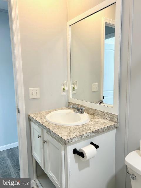 26 2nd Street Lothian, MD 20711 - Photo 19 of 27 a bathroom with a granite countertop sink and a mirror