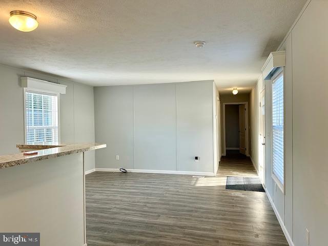 26 2nd Street Lothian, MD 20711 - Photo 21 of 27 an empty room with wooden floor and windows