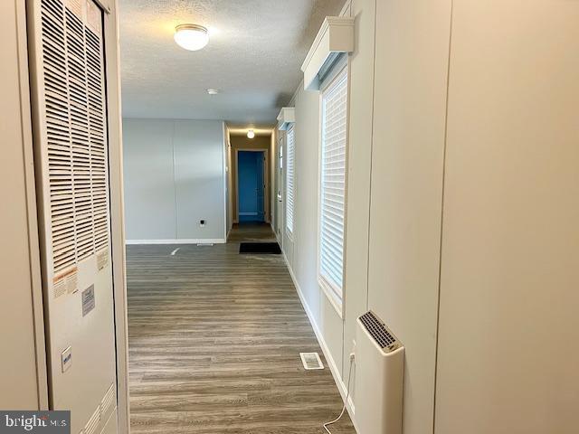 26 2nd Street Lothian, MD 20711 - Photo 22 of 27 a view of a hallway with wooden floor and staircase