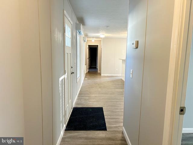 26 2nd Street Lothian, MD 20711 - Photo 23 of 27 a view of a hallway with wooden floor and a bathroom