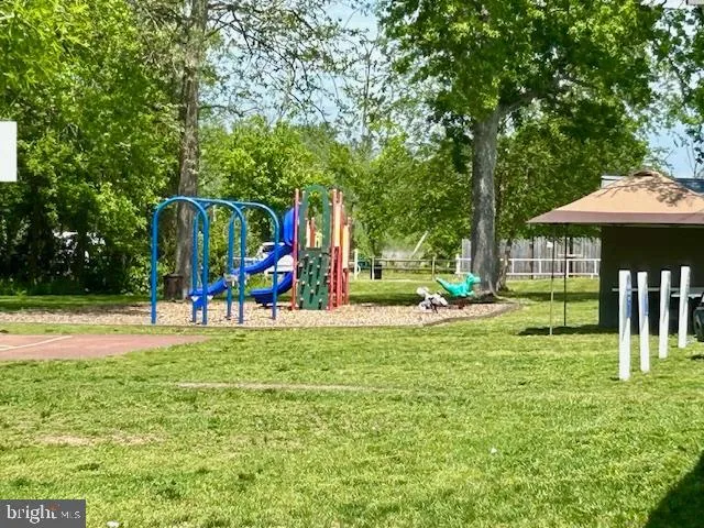 a view of a park with swings and slides