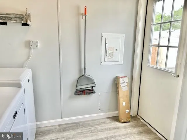 a view of small space with wooden floor and windows