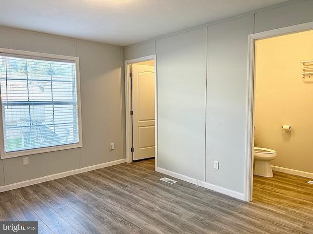 26 2nd Street Lothian, MD 20711 - Photo 10 of 27 a view of a room with wooden floor and a window