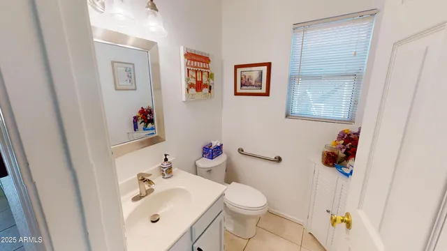 a bathroom with a sink toilet and vanity
