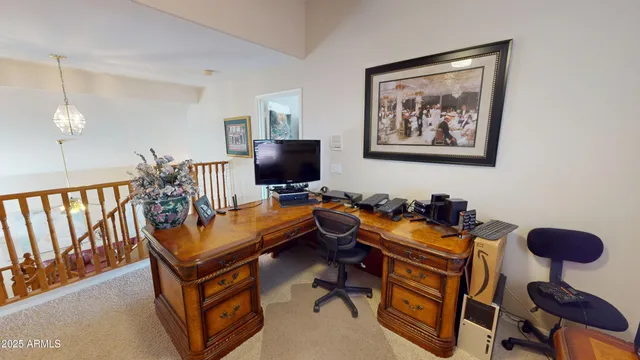 a view of a workspace with furniture and a couch