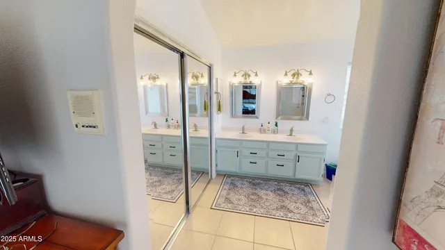 a bathroom with a granite countertop sink mirror and shower