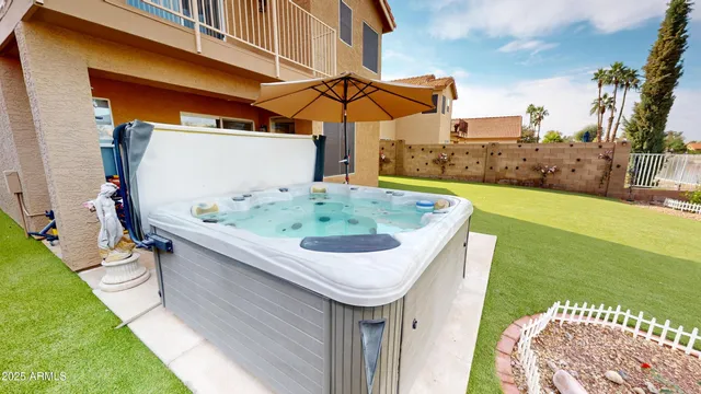 a swimming pool with outdoor seating and yard