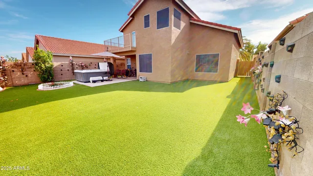 a swimming pool with yard and outdoor seating