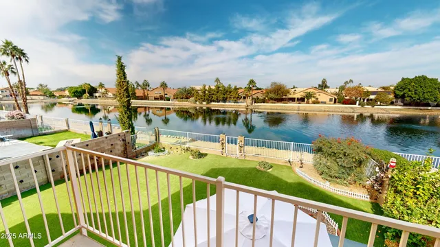 a view of a lake with boats and trees in the background
