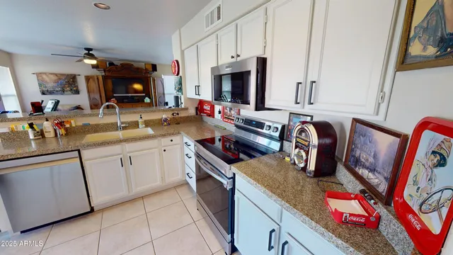 a kitchen with cabinets and window
