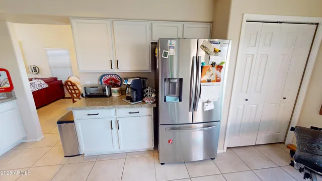 a kitchen with stainless steel appliances a refrigerator and a stove