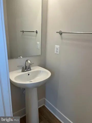 a bathroom with a sink and mirror
