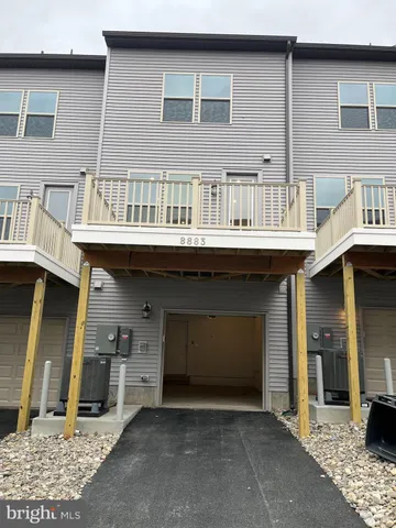 a front view of a house with barbeque area
