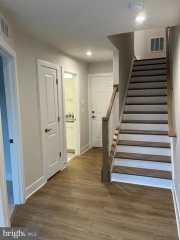 a view of entryway with wooden floor