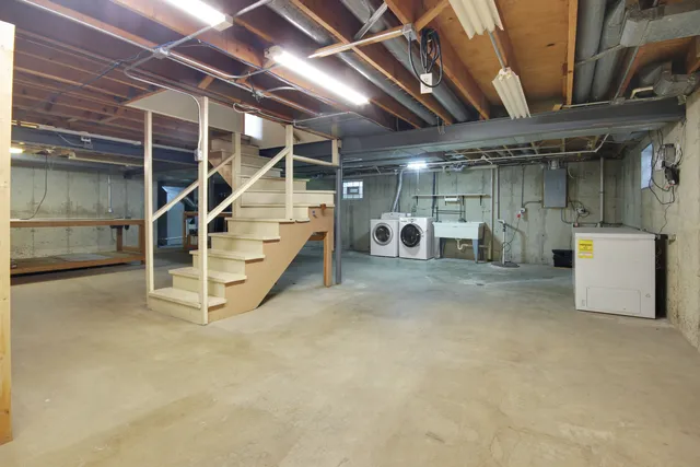 a view of an empty room with white walls