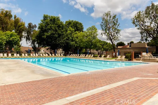 a view of street with houses and trees in the background