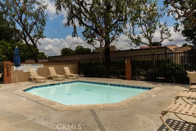a view of a swimming pool with a patio