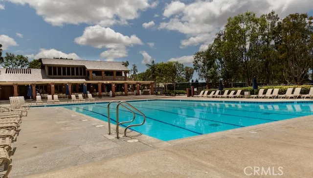 a view of a swimming pool with chairs
