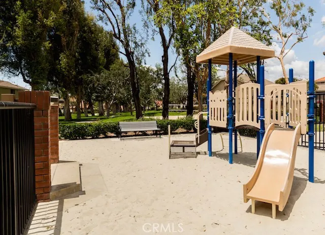 a view of a swimming pool with a lounge chair and floor to ceiling window