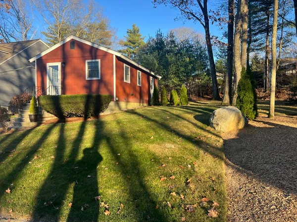 a front view of a house with a yard