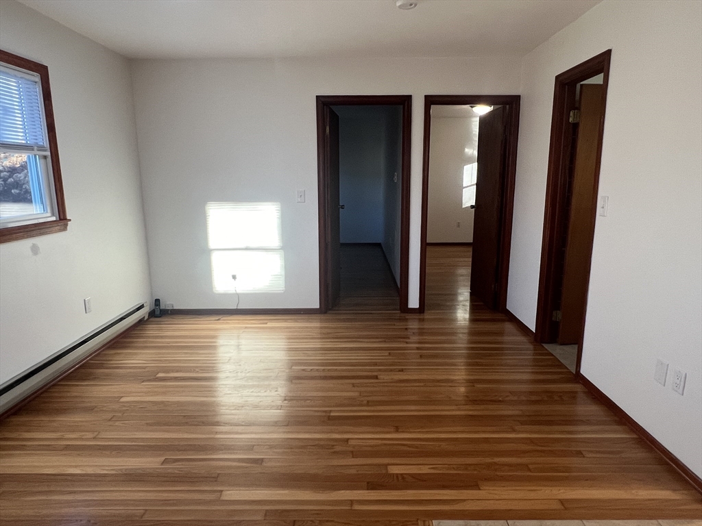 5 2nd Road, Unit 5 Hopkinton, MA 01748 - Photo 8 of 19 a view of a room with wooden floor and window