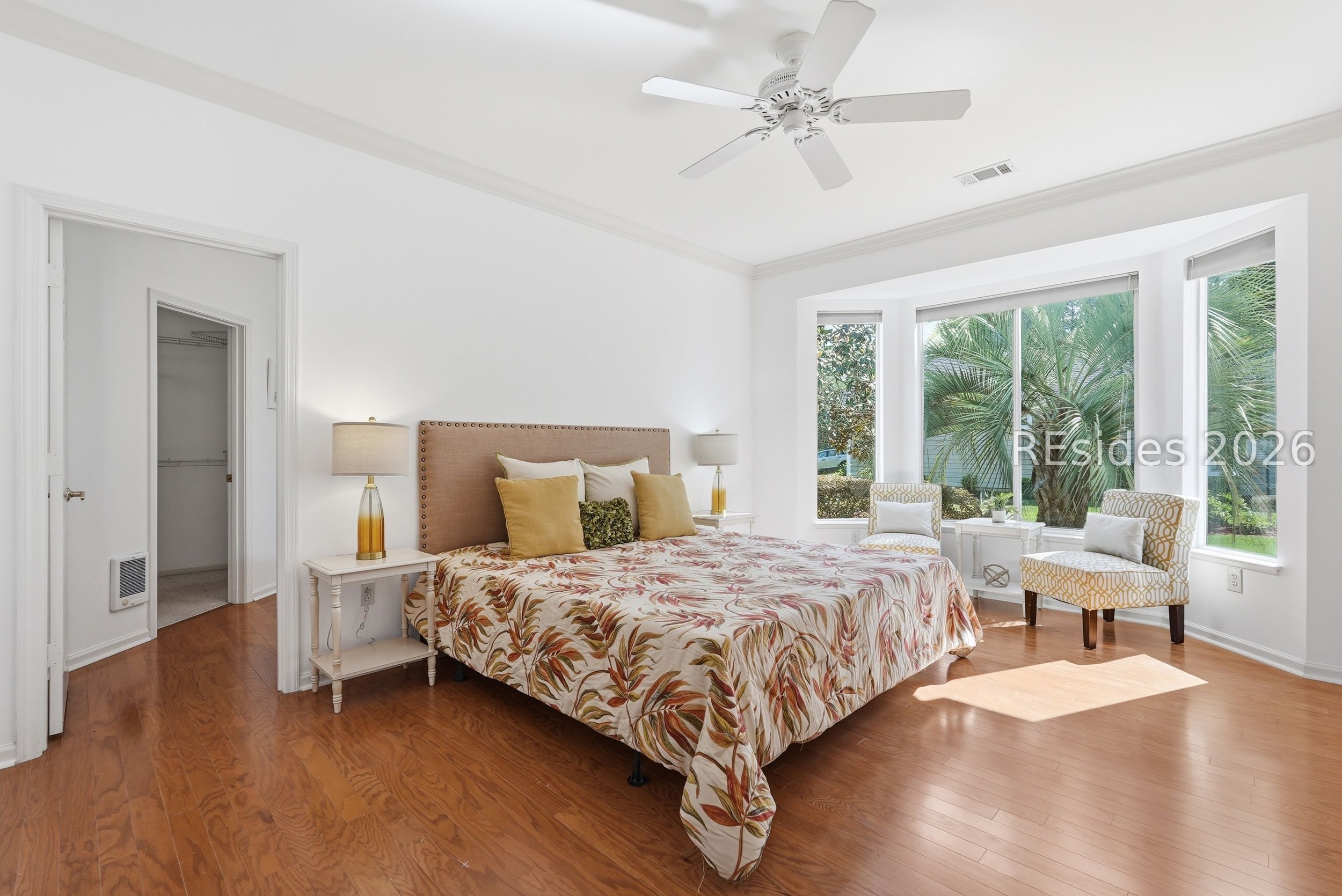 1 Caleb Court Bluffton, SC 29909 - Photo 26 of 70 Spacious primary suite w/ peaceful backyard views.