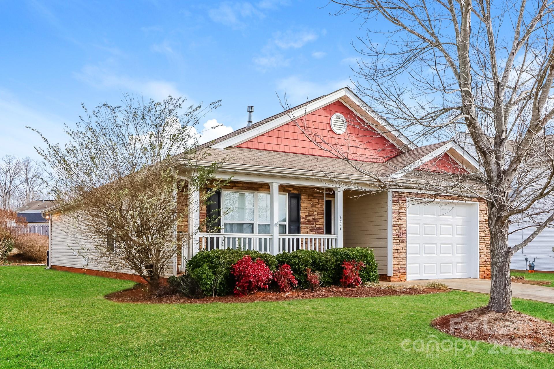 3624 Crowders View Drive Gastonia, NC 28052 - Photo 2 of 16 a front view of a house with a garden and plants