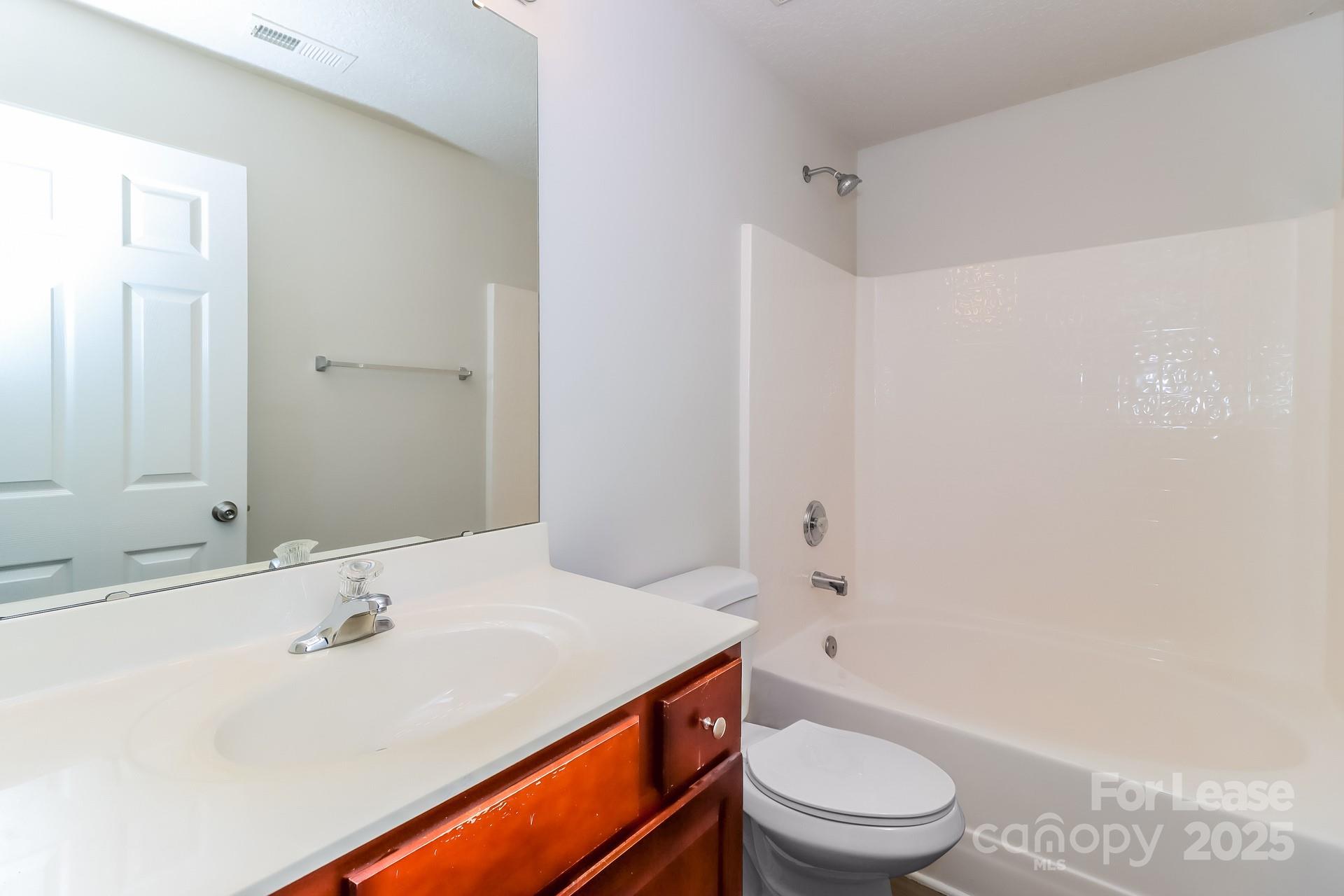 3624 Crowders View Drive Gastonia, NC 28052 - Photo 9 of 16 a bathroom with a sink a toilet and shower