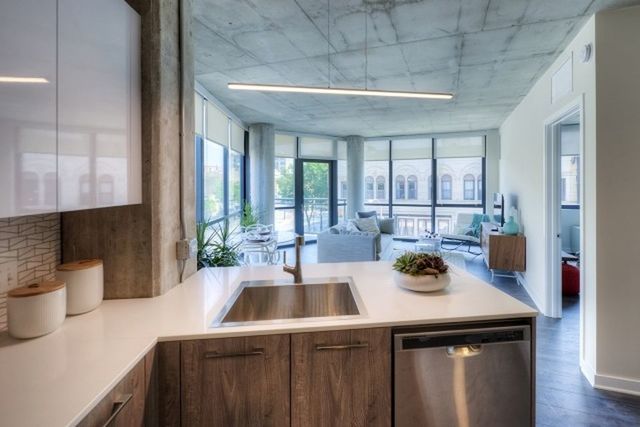 Undisclosed Address Chicago, IL 60657 - Photo 2 of 12 a kitchen with a sink and a refrigerator