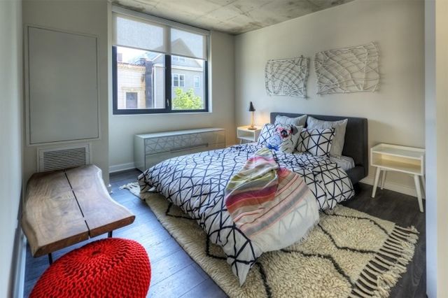 Undisclosed Address Chicago, IL 60657 - Photo 5 of 12 a bedroom with a bed and window