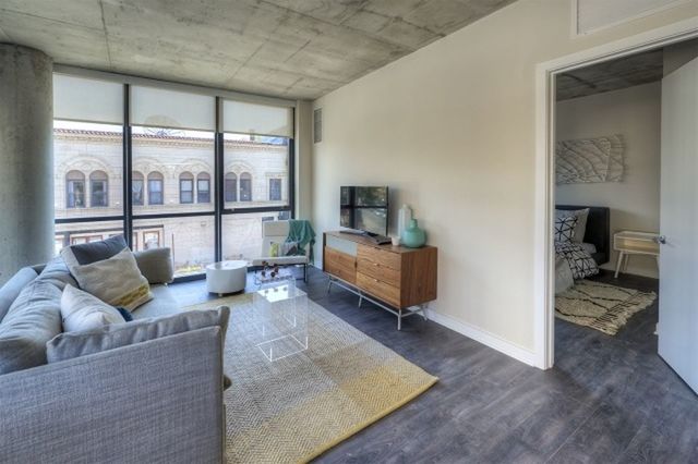 Undisclosed Address Chicago, IL 60657 - Photo 6 of 12 a living room with furniture and a large window