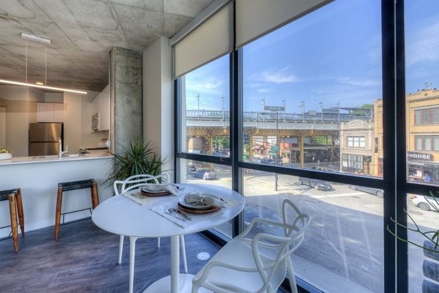 Undisclosed Address Chicago, IL 60657 - Photo 8 of 12 a view of a dining room with furniture window and wooden floor