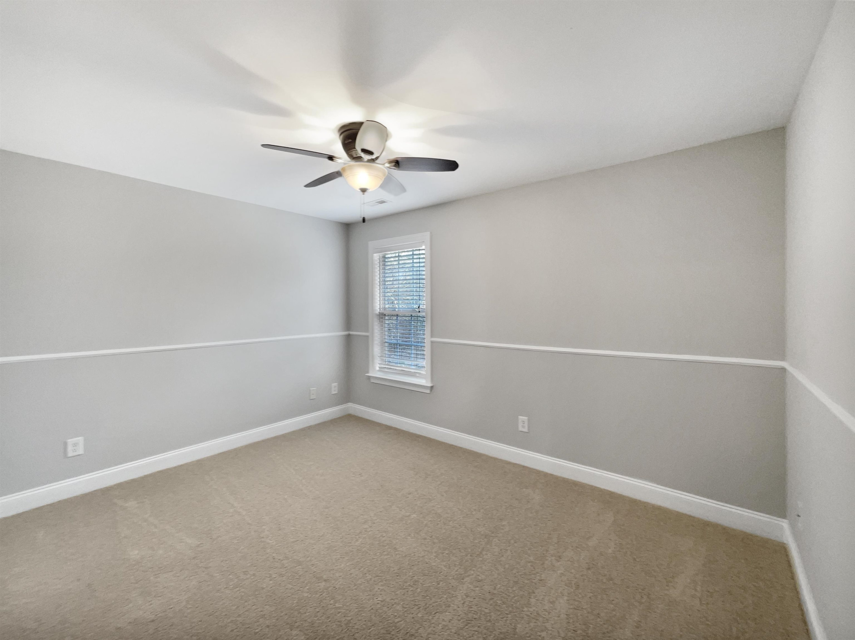 90 Bertram Drive Clayton, NC 27520 - Photo 12 of 19 an empty room with a empty space and a ceiling fan