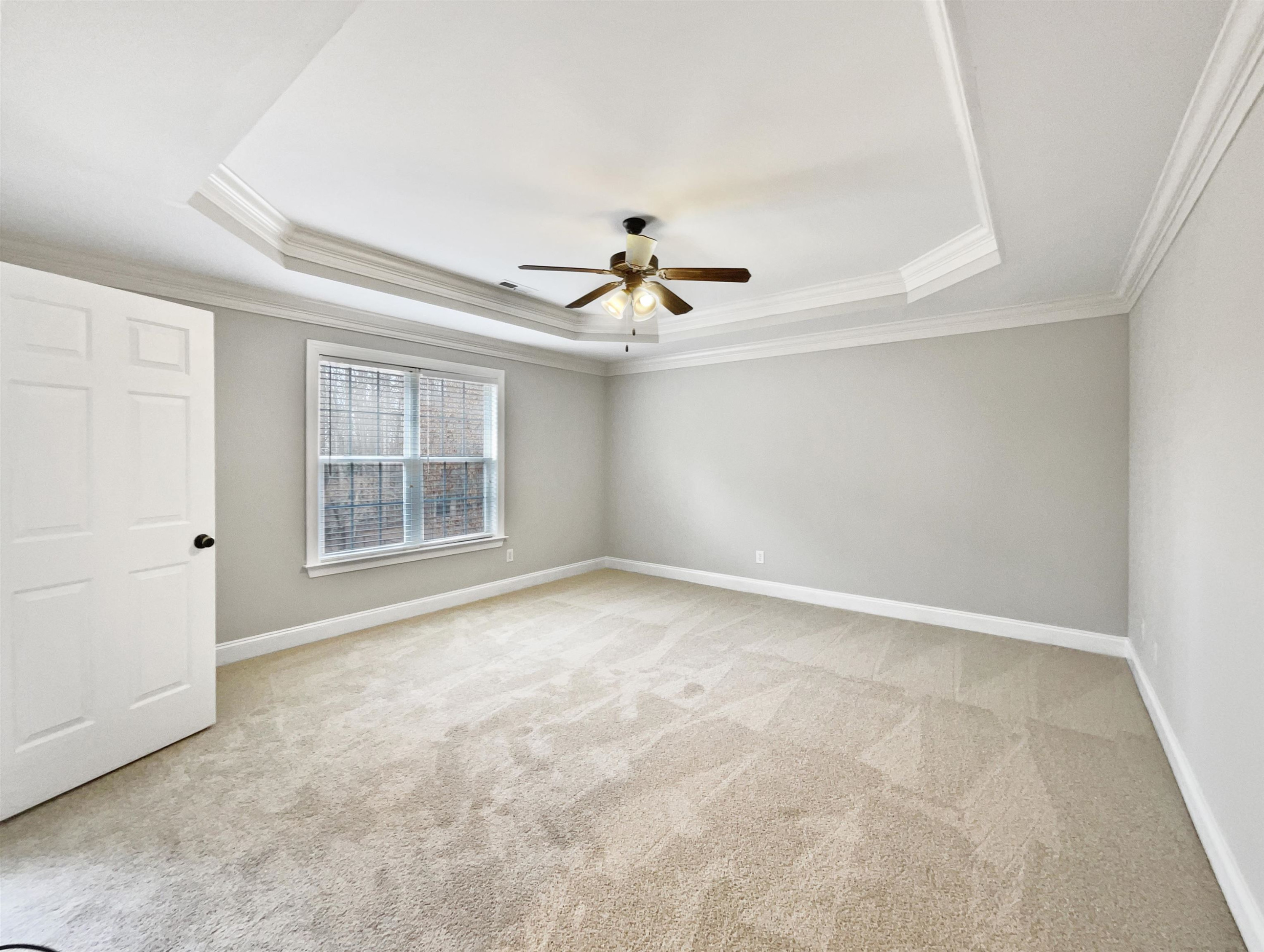 90 Bertram Drive Clayton, NC 27520 - Photo 14 of 19 an empty room with windows and ceiling fan