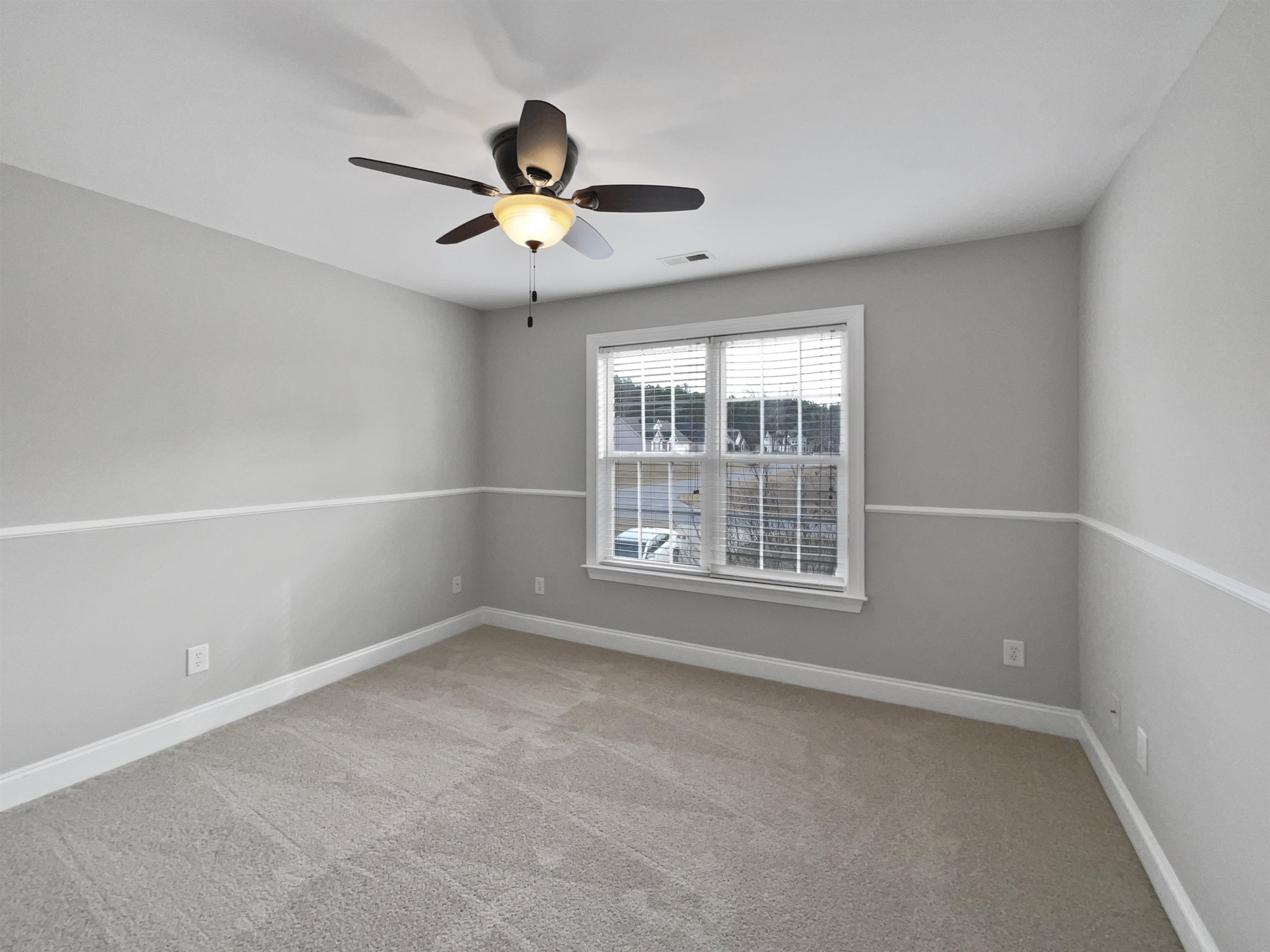 90 Bertram Drive Clayton, NC 27520 - Photo 19 of 19 a view of an empty room with a window