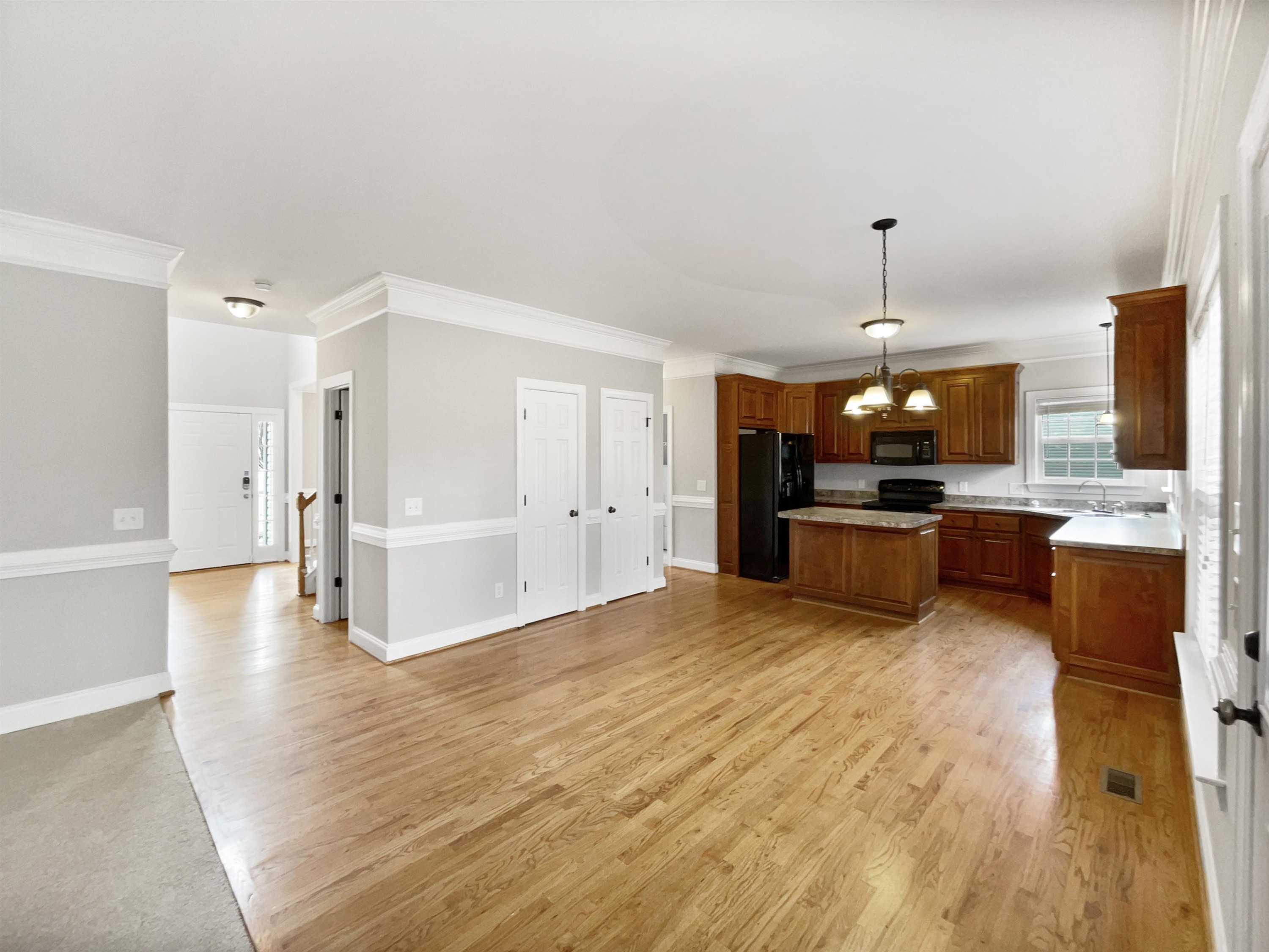 90 Bertram Drive Clayton, NC 27520 - Photo 6 of 19 a large white kitchen with a refrigerator a stove and a sink
