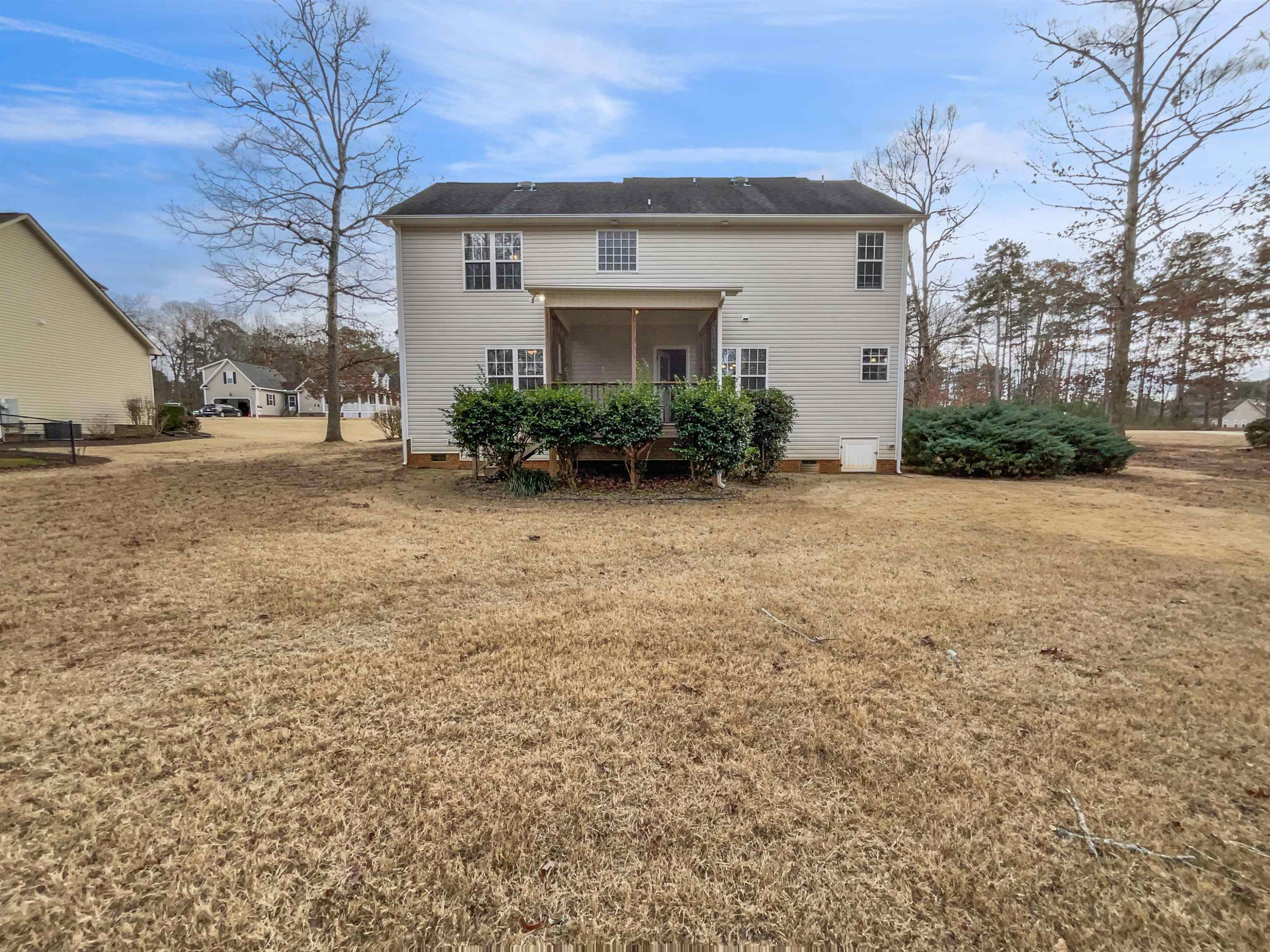 90 Bertram Drive Clayton, NC 27520 - Photo 10 of 19 a front view of a house with a yard and garage