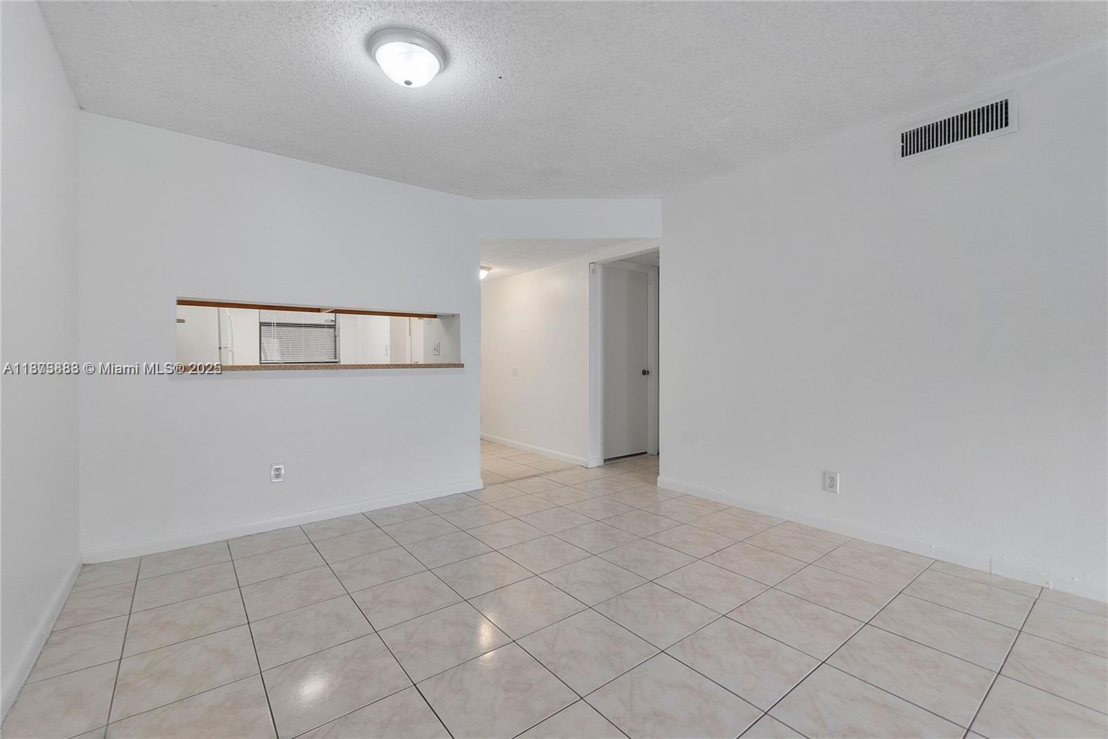 3399 Foxcroft Road, Unit 108 Miramar, FL 33025 - Photo 12 of 15 a view of a room with white walls