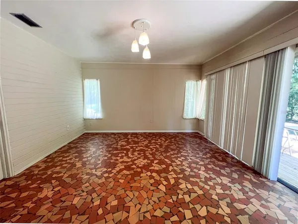 a view of an empty room and window