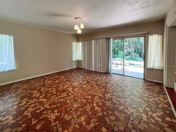 a view of an empty room and window