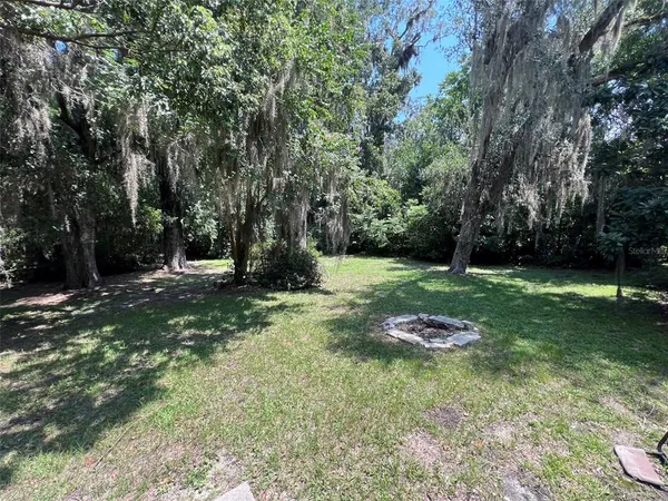 a backyard of a house with lots of green space
