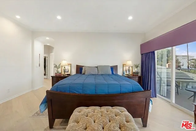a large bathroom with a granite countertop sink a mirror and a bathtub
