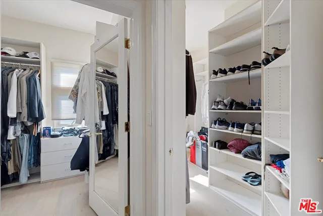 a living room with a balcony furniture and a window